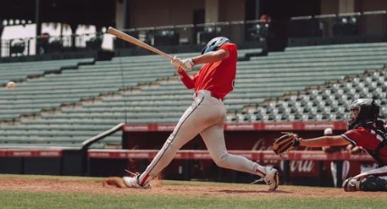Baseball batter finishing a swing
