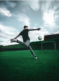 Soccer player striking the ball
